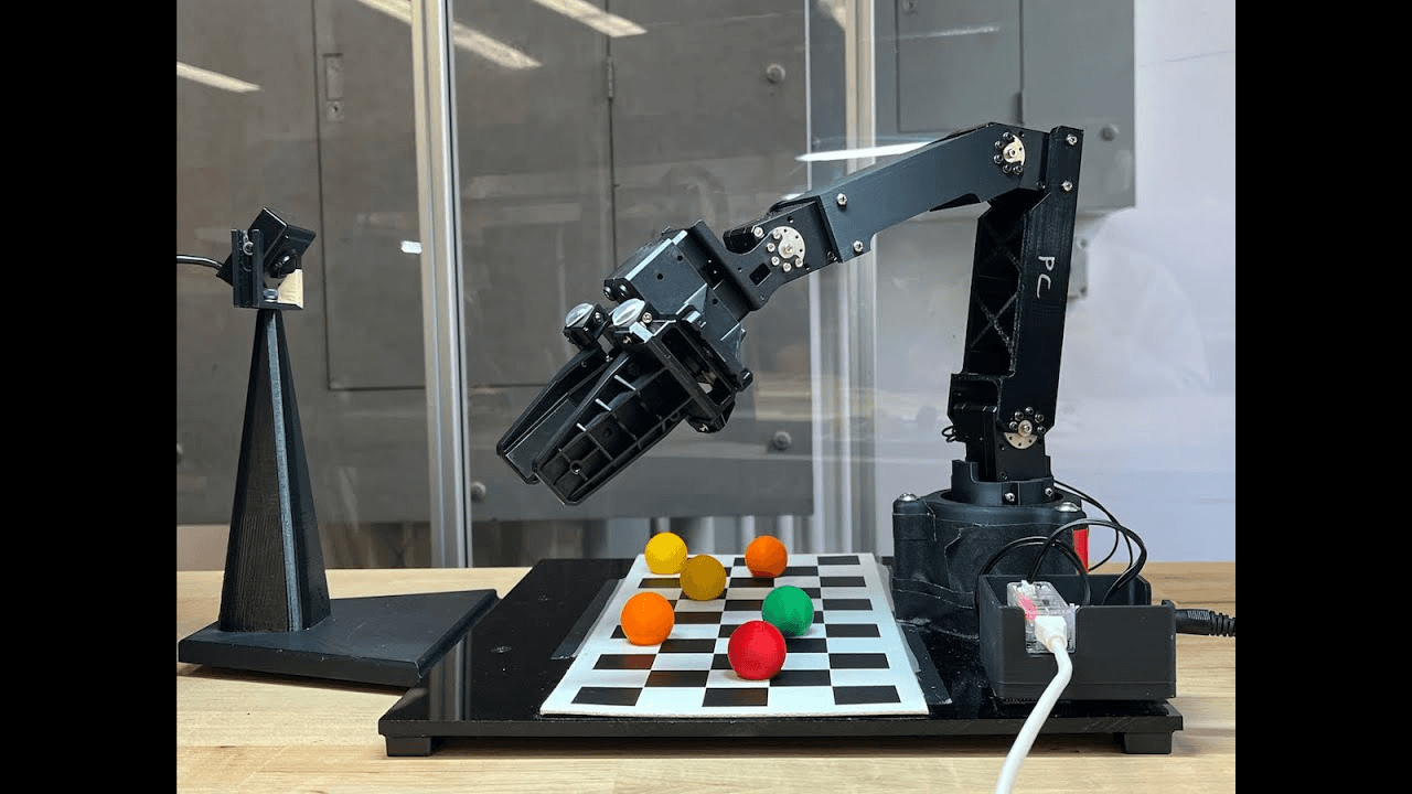 4-DOF robot arm sorting colored balls on a checkerboard